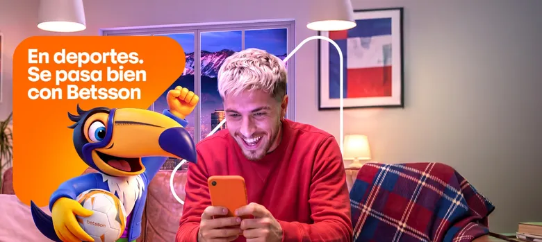 Banner de Betsson con su mascota tucán sosteniendo un balón junto a un hombre sonriente que mira su teléfono, y el lema «En deportes. Se pasa bien con Betsson».