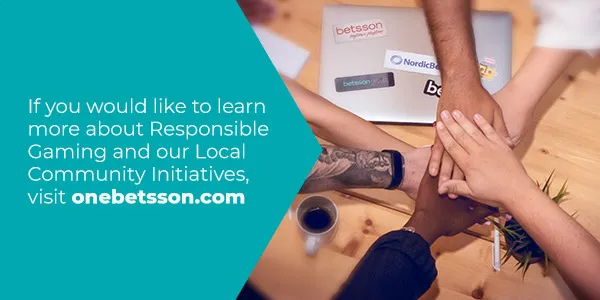 Pieza corporativa de Betsson con manos unidas sobre una mesa de trabajo.